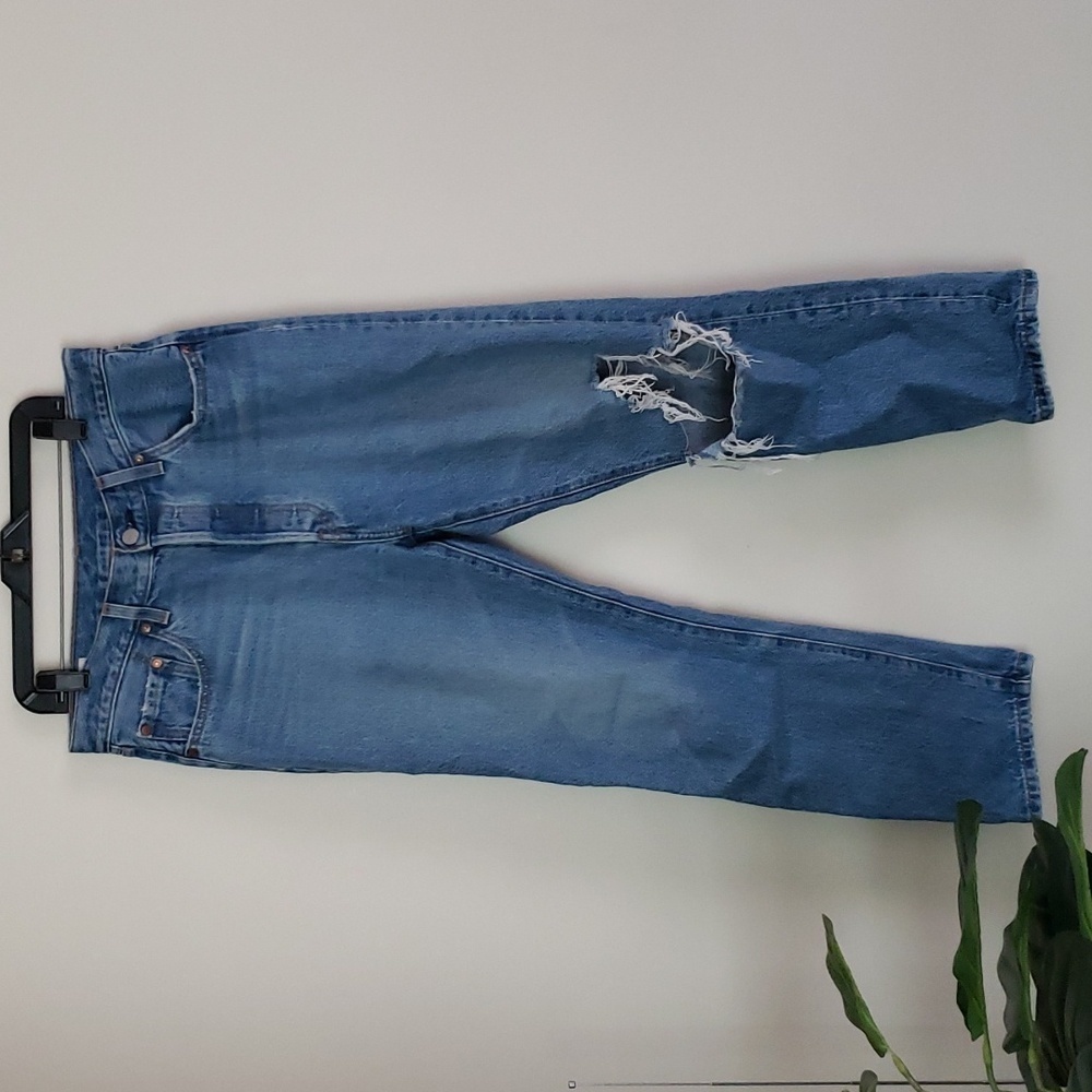 Levi's 501 medium wash straight leg jeans, quality denim, and button fly.